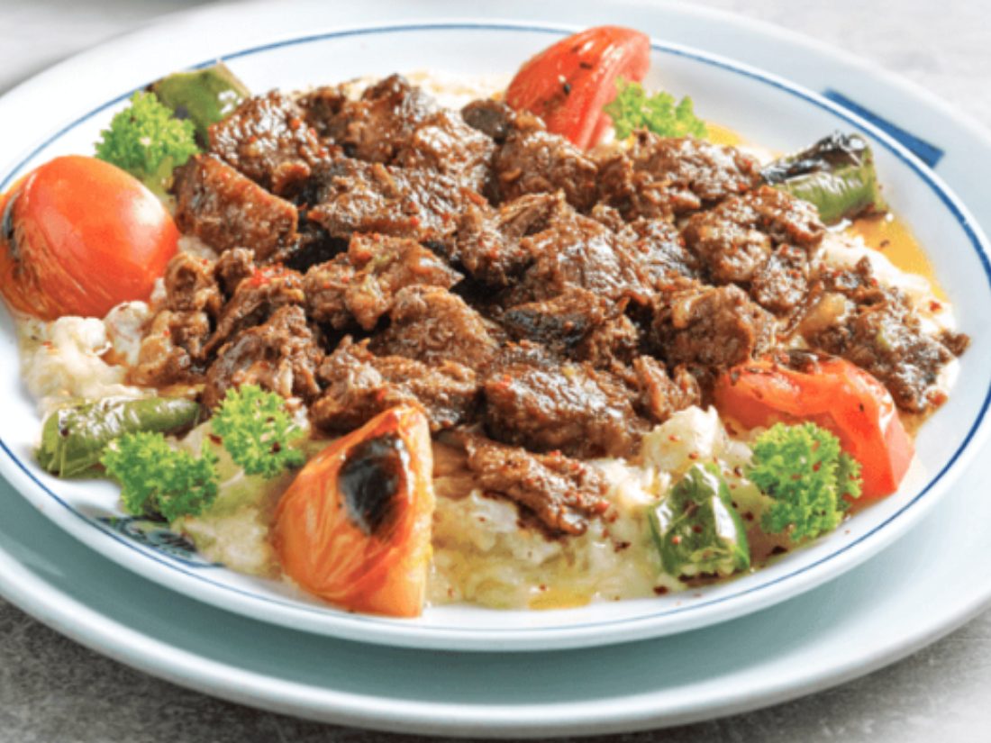 Hünkar Beğendi — braised lamb in tomato sauce over creamy smoked aubergine purée